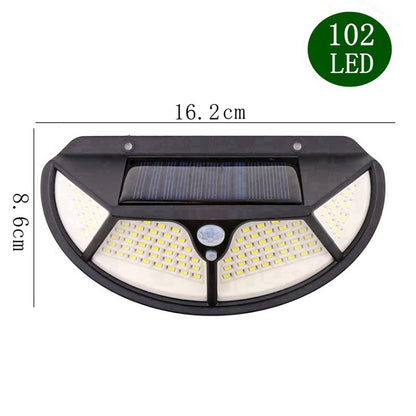 Lámpara de pared solar LED para exteriores, de cuatro caras iluminadas, con sensor de movimiento, ideal para jardines y patios.